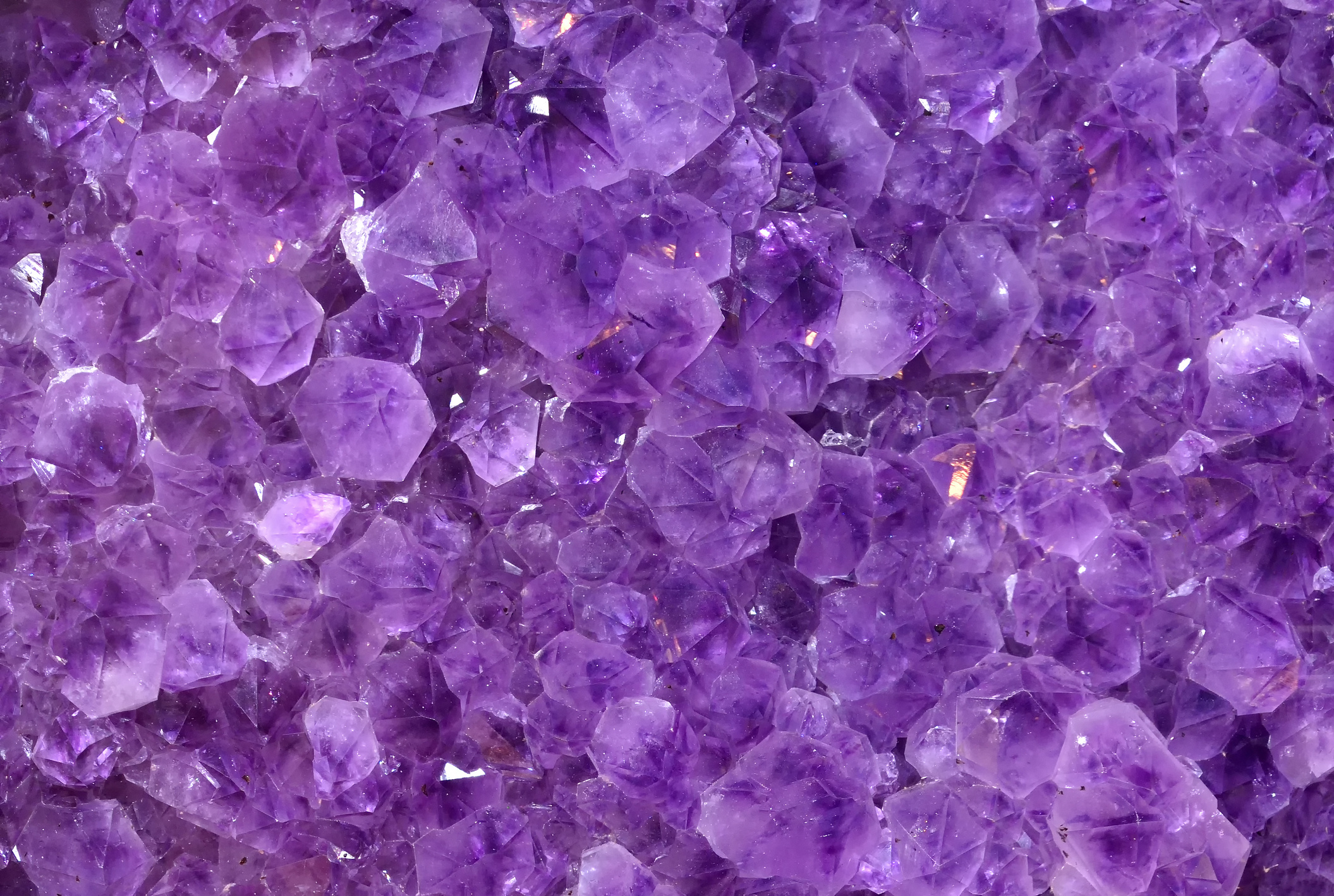Gemstones amethyst bright purple, texture of stone. Beautiful background of amethyst stones